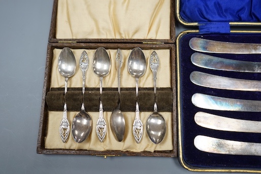 A set of six silver coffee spoons and a set of six silver handled tea knives